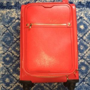 Henri Bender carry-on sized rolling suitcase.
